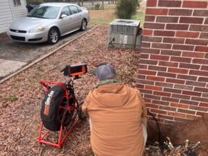 image1 (4) septic employee checking pipes with camera
