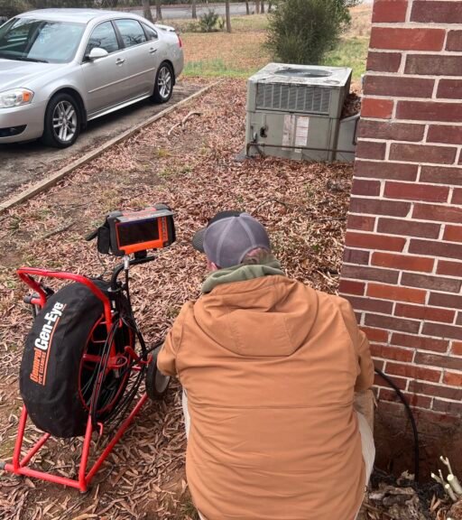 image1 (4) septic employee checking pipes with camera